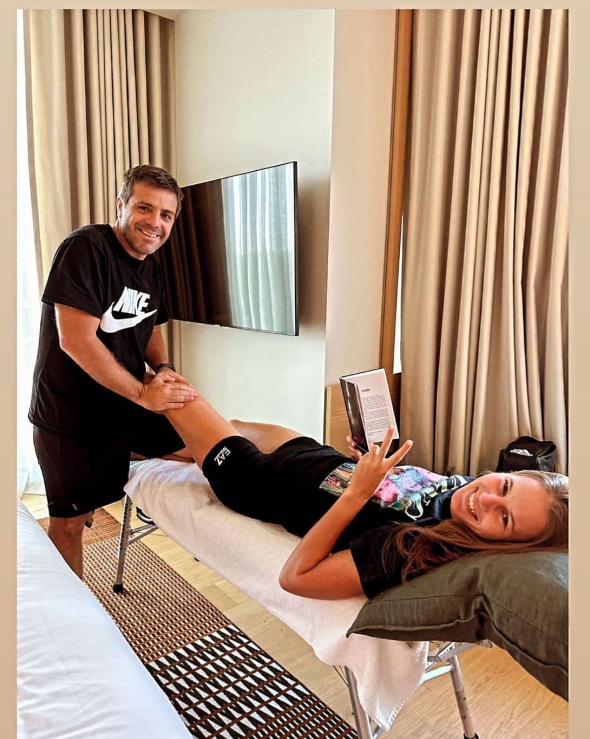 Juan Pablo Pagano providing hands-on recovery treatment to Veronika Kudermetova